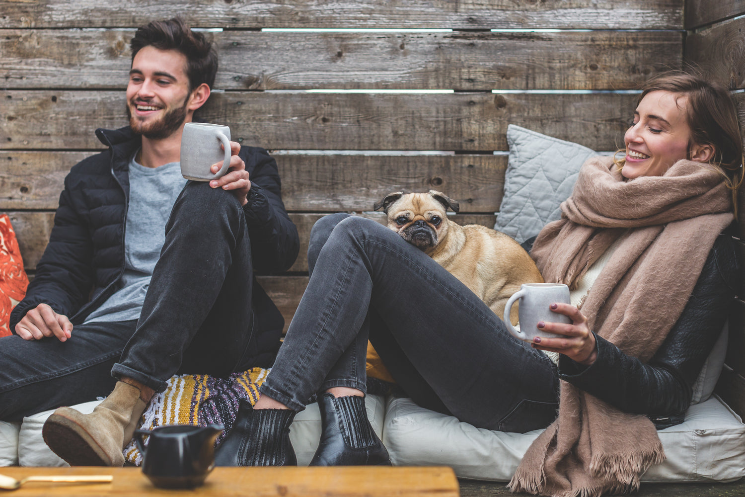 Customer testimonial image for Xiderdl Calming Chews for Dogs showing a pug sitting with pet owners at home.
